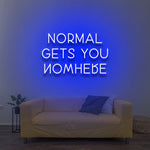Motivational 'Normal Gets You Nowhere' LED neon sign in blue, perfect for inspiring originality and ambition in your home office or creative space.