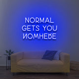 Motivational 'Normal Gets You Nowhere' LED neon sign in blue, perfect for inspiring originality and ambition in your home office or creative space.