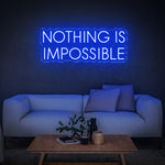 Bold blue 'Nothing Is Impossible' LED neon sign, a motivational décor piece perfect for any home or office, inspiring success and positivity.