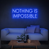 Bold blue 'Nothing Is Impossible' LED neon sign, a motivational décor piece perfect for any home or office, inspiring success and positivity.