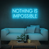 Bright light blue 'Nothing Is Impossible' LED neon sign, a perfect addition to your home or office to inspire motivation and a positive mindset.