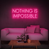 Eye-catching pink 'Nothing Is Impossible' LED neon sign, an ideal motivational décor for home or office spaces, reminding you to believe in limitless possibilities.