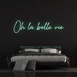 Refreshing sea green 'Oh la Belle Vie' LED neon sign, adding a calm and peaceful vibe to your home or office, while inspiring you to enjoy the beauty of life.
