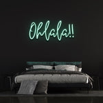 Fresh green 'Ohlala' LED neon sign, bringing a lively and vibrant energy to your space, great for adding personality to a living room or event.