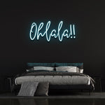 Cool light blue 'Ohlala' LED neon sign, ideal for creating a fun and lively atmosphere in any room, with its soft glow and whimsical design.