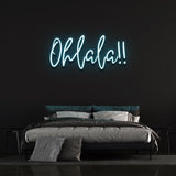 Cool light blue 'Ohlala' LED neon sign, ideal for creating a fun and lively atmosphere in any room, with its soft glow and whimsical design.