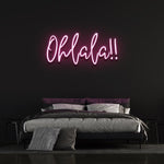 Playful pink 'Ohlala' LED neon sign, adding a pop of color and charm to your space, perfect for parties or creating a fun vibe in any room.