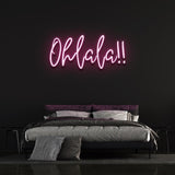 Playful pink 'Ohlala' LED neon sign, adding a pop of color and charm to your space, perfect for parties or creating a fun vibe in any room.