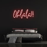 Vibrant red 'Ohlala' LED neon sign, perfect for home décor or event spaces, adding a playful and chic touch with its bold neon glow.