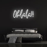 Elegant white 'Ohlala' LED neon sign, a stylish and minimalist piece that brightens up your home or event décor with its clean, chic glow.