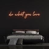 Orange 'Do What You Love' neon sign on bedroom wall, motivational light