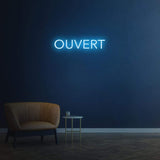 Bright 'Ouvert' LED neon sign, customizable for businesses to attract foot traffic and indicate availability.