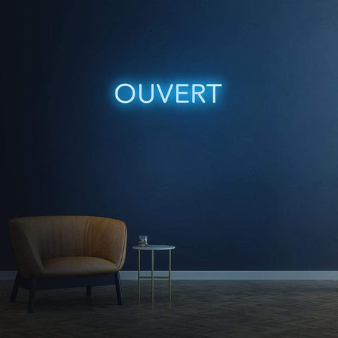 Bright 'Ouvert' LED neon sign, customizable for businesses to attract foot traffic and indicate availability.