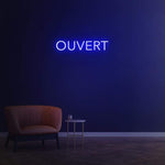 Energy-efficient 'Ouvert' LED neon sign, perfect for business windows to signal customers that you are open."