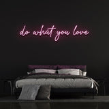 Pink 'Do What You Love' neon sign in bedroom, aesthetic motivational neon light