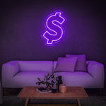 Purple dollar sign neon light wall art decor above a modern sofa setup, ideal for stylish home or office interiors.