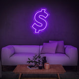 Purple dollar sign neon light wall art decor above a modern sofa setup, ideal for stylish home or office interiors.