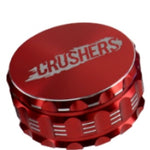 Red 100mm Crushers metal grinder, featuring a durable design for grinding herbs.