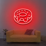 Red donut LED neon sign as vibrant wall lighting for stylish home decor.