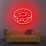 Red donut LED neon sign as vibrant wall lighting for stylish home decor.