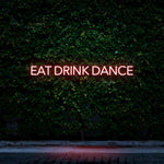 Red LED neon sign Eat Drink Dance for bars, clubs, and entertainment areas.