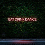 Red LED neon sign Eat Drink Dance for bars, clubs, and entertainment areas.