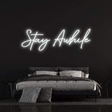 leek "Stay Awhile" LED neon sign with a warm, glowing light for creating a relaxing environment in your space.