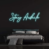 Stylish "Stay Awhile" LED neon sign, adding a modern touch and gentle glow to any room or office space.