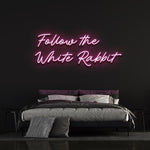 White Rabbit neon light with vibrant LED glow, creating mystical wall decor for homes or events.