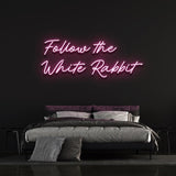 White Rabbit neon light with vibrant LED glow, creating mystical wall decor for homes or events.