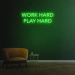 Work Hard Play Hard neon sign in green light, perfect for inspiring office decor or modern home aesthetics.
