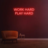Work Hard Play Hard neon sign in red light, perfect for inspiring office decor or modern home aesthetics.