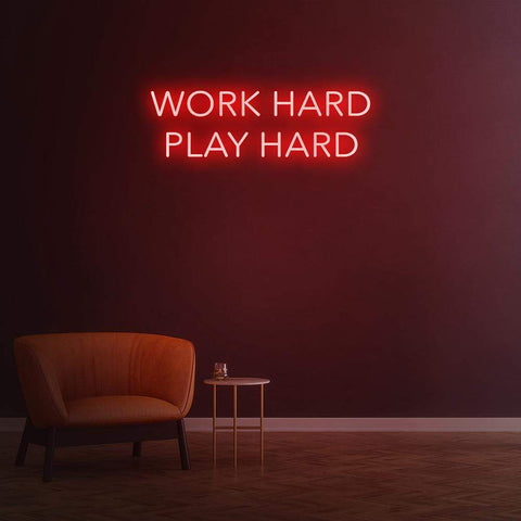 Work Hard Play Hard neon sign in red light, perfect for inspiring office decor or modern home aesthetics.