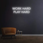 Work Hard Play Hard neon sign in white light, perfect for inspiring office decor or modern home aesthetics.