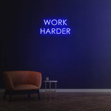 Work Harder blue neon sign on a dark wall, perfect for gym or home decor, motivational LED neon sign for productivity.