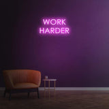 Work Harder purple neon sign on a dark wall, perfect for gym or home decor, motivational LED neon sign for productivity.