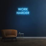 Work Harder white neon sign on a dark wall, perfect for gym or home decor, motivational LED neon sign for productivity.