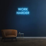 Work Harder white neon sign on a dark wall, perfect for gym or home decor, motivational LED neon sign for productivity.