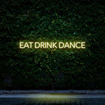 Yellow LED neon sign Eat Drink Dance for restaurants, cafes, and home wall art.