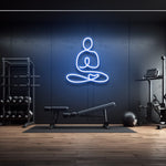 Yoga icon LED neon sign in blue light, wall decor for gym or fitness room with modern workout equipment, perfect for gym lighting aesthetics.