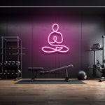 Yoga icon LED neon sign in hot pink light, wall decor for gym or fitness room with modern workout equipment, perfect for gym lighting aesthetics.
