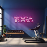 Pink yoga LED neon sign illuminating a fitness room for a vibrant and modern gym decor.